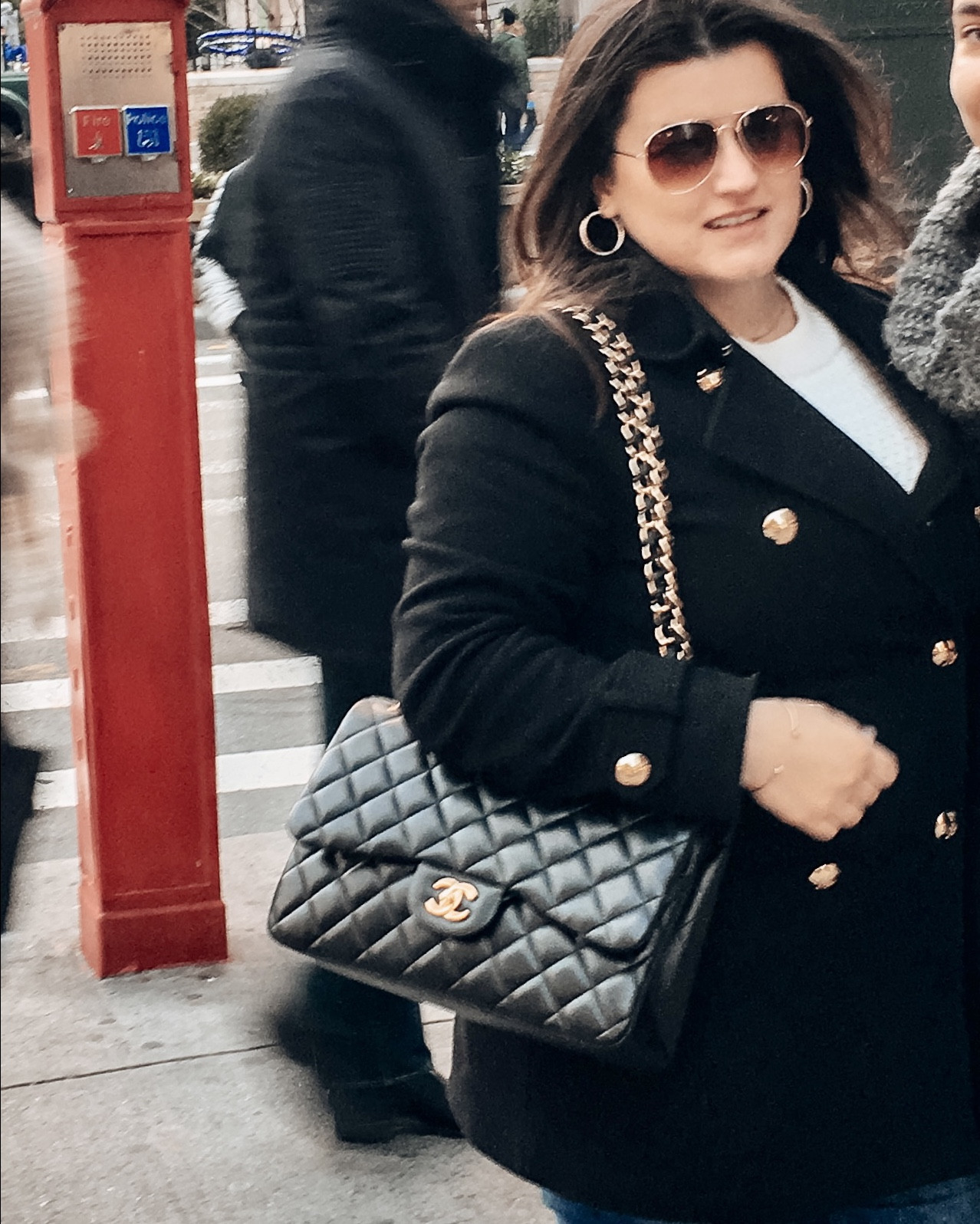 Chanel quilted jumbo with gold hardware, paired with aviator sunglasses, and a black coat with gold buttons 

#LTKSeasonal #LTKItBag #LTKWorkwear