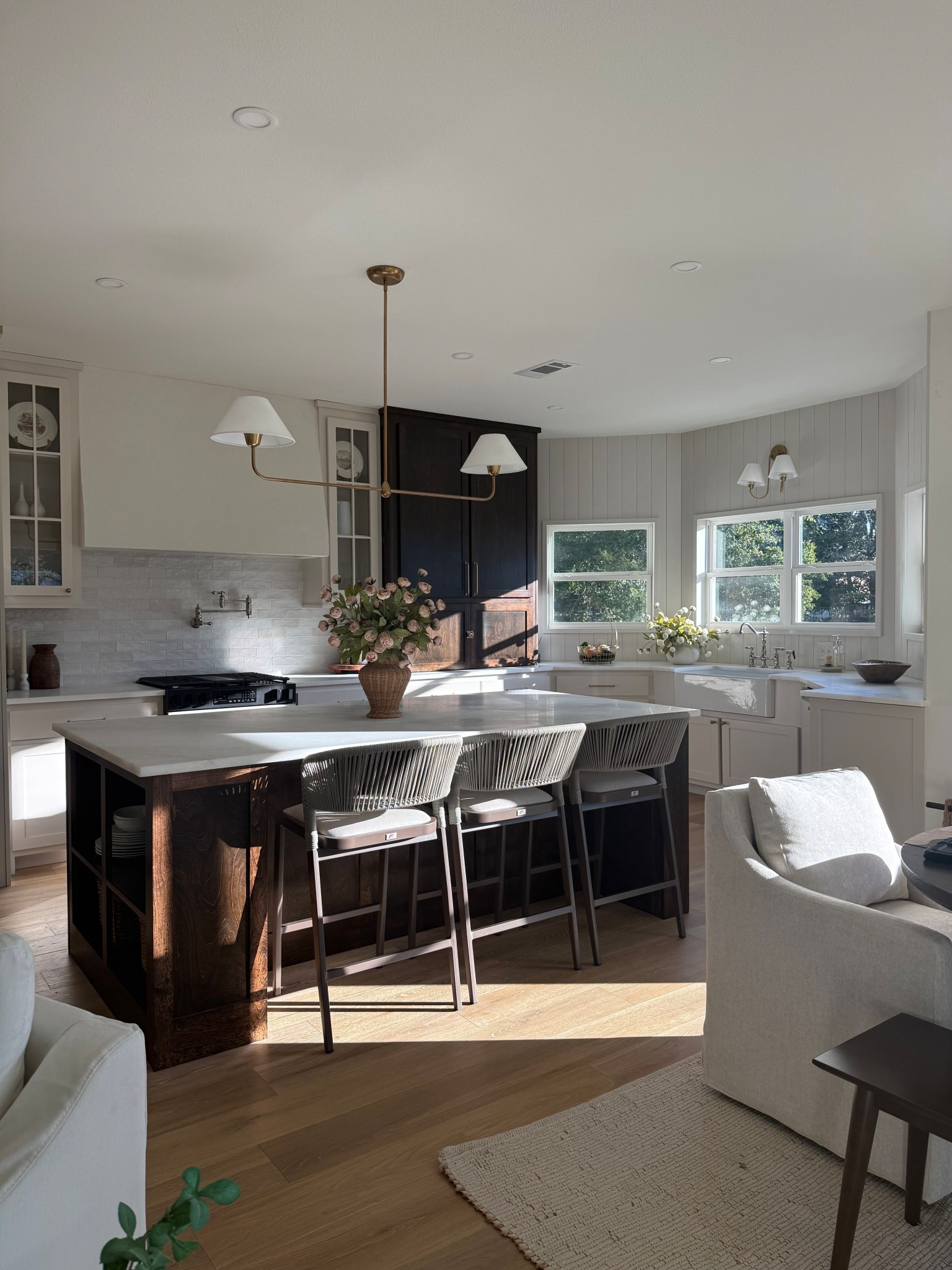 Kitchen styling. Pot filler. Linear chandelier. Peonies. Sconce. Counter stools. Purple leaf. Dining chair. Kitchen decor. Kitchen faucet  

#LTKHome