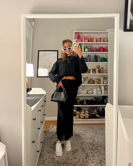 Winter in Europe outfit ideas a- styling a midi skirt with an oversized sweater and platform sneakers. My go to for this time of year 