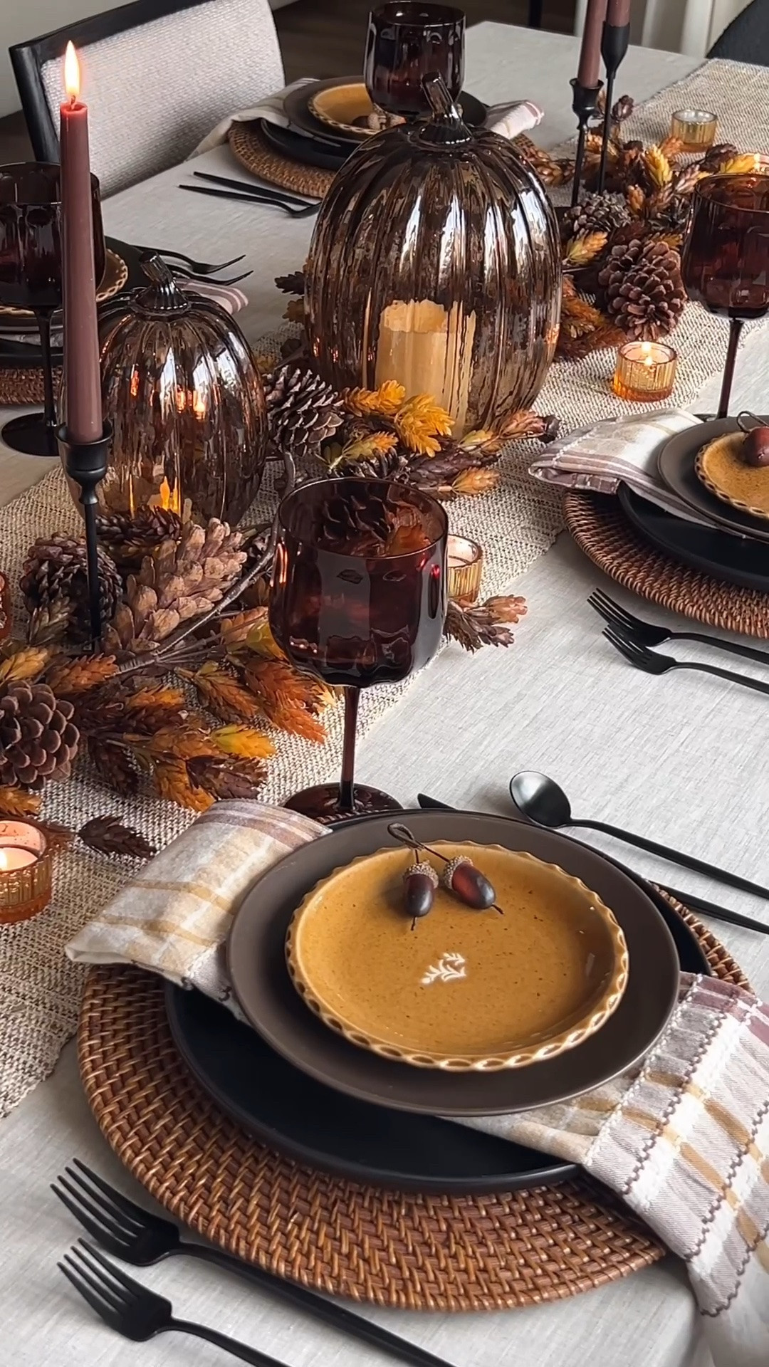 Fall tablescape decor, moody fall table setting, autumn hosting ideas, Thanksgiving table decor, chocolate brown dinnerware, golden ochre accent plates, brown glass goblets, amber glassware, plaid cloth napkins, black flatware, black candlesticks, chocolate brown taper candles, amber votive holders, smoky glass pumpkins, woven rattan chargers, neutral table runner, fall table garland, pinecone centerpiece, layered place settings, warm fall color palette, modern fall decor, elegant Thanksgiving table, chocolate brown sweater, brown press-on nails

#LTKHome #LTKSeasonal