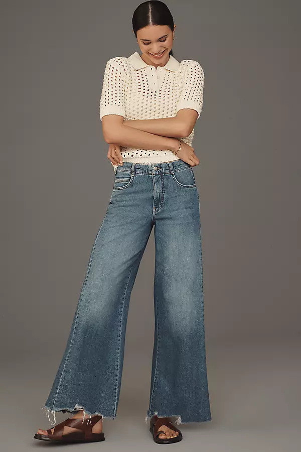 The Adi Regenerative Cotton Mid-Rise Frayed Relaxed Flare Jeans by Pilcro | Anthropologie (US)