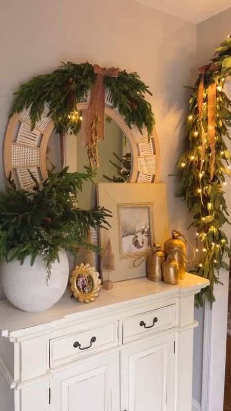 Christmas decor in the entryway! 

Loving these Norfolk Pine Branches with pine cones - came as a set of 6. Also combined with 2 Afloral Norfolk Pine Branch stems.

Gold Christmas bells with jute rope, decorative set of 3 gold bells, Christmas wall art, Christmas Art print, round gold picture frame, 6 pack of lighted branches, warm white pre lit twig branches, seeded eucalyptus Garland, Afloral real touch Norfolk pine Garland, Nathan James oval coffee table, light oak coffee table, Collection Prints Winter Scene, evergreen wall art print, light oak gallery frame. 

#LTKhome #LTKSeasonal #LTKHoliday
