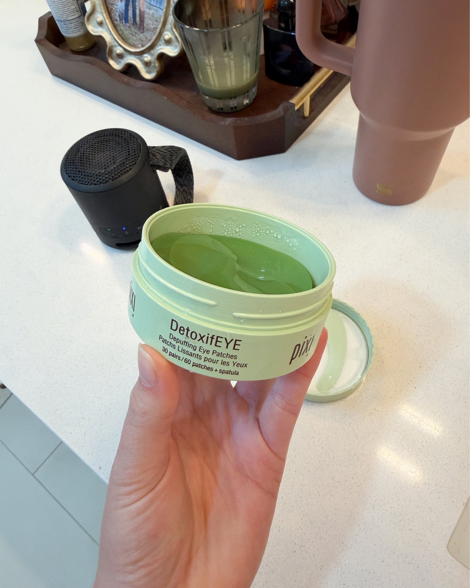 Getting ready faves 🤣❤️ these eye patches that I keep in the fridge and my portable speaker!