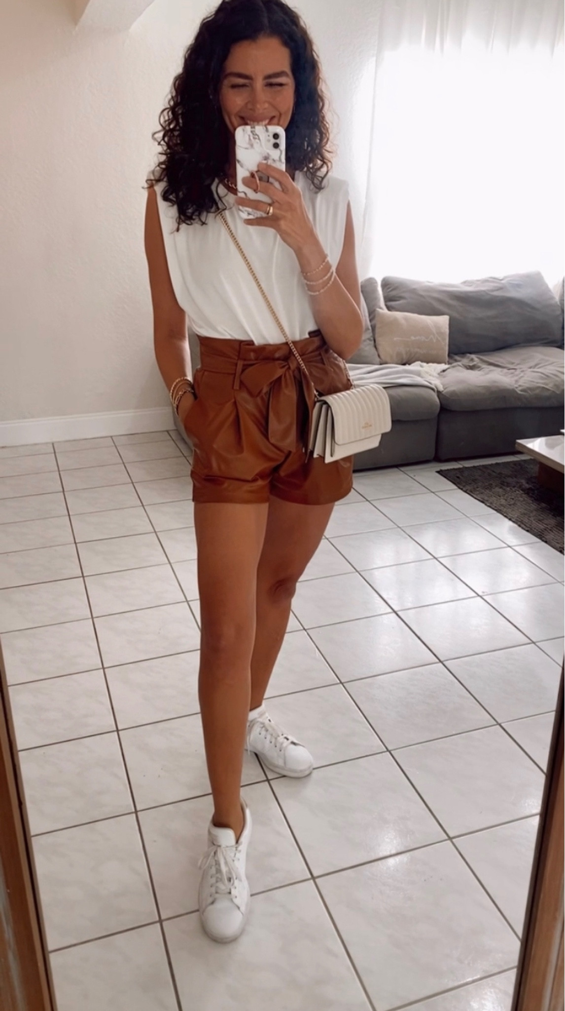 Shorts are true to size. Wearing a size lol in the top! Faux leather shorts, casual outfit, sneakers outfit 

#LTKSeasonal #LTKFind #LTKsalealert