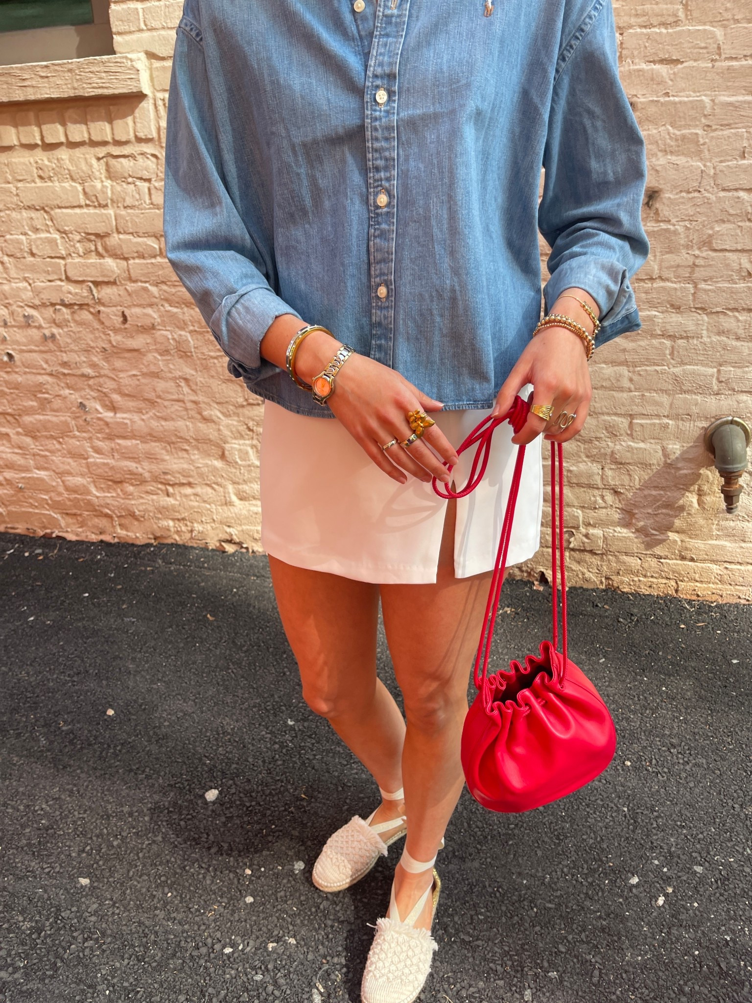 for some reason, i can’t link the shirt but it’s the ralph lauren Cropped Boxy Denim Shirt!