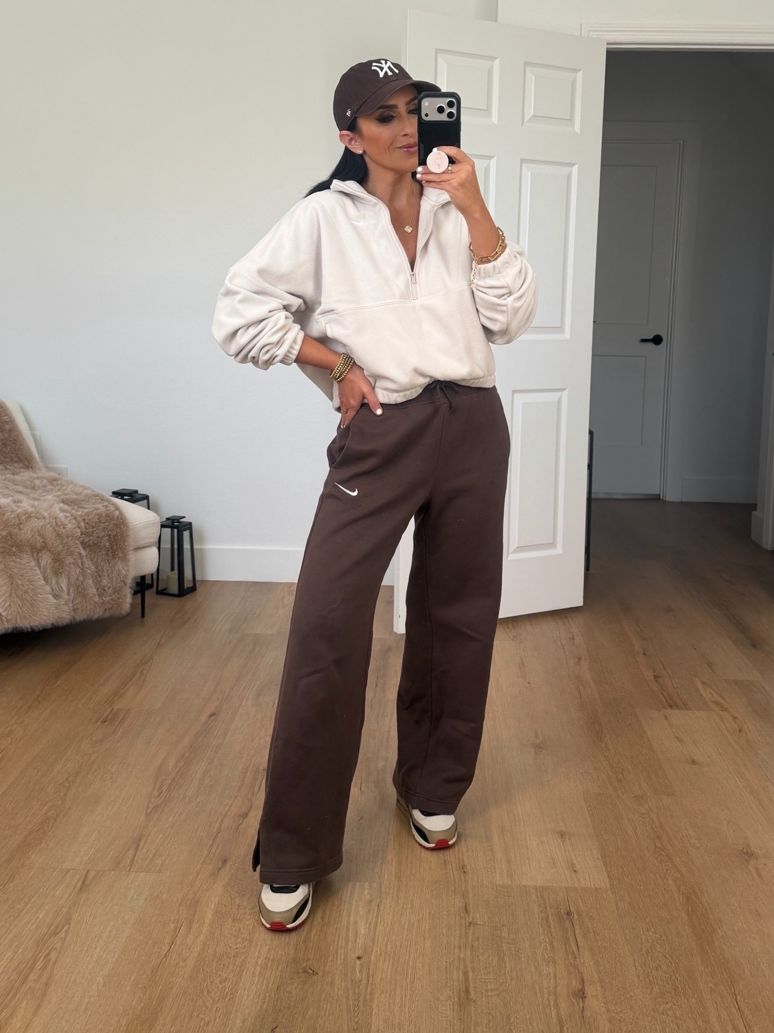 Nike One Women's Therma-FIT Oversized 1/2-Zip Fleece Top wearing size small. Nike Sportswear Phoenix Fleece Women's High-Waisted Wide-Leg Pants wearing size medium. 