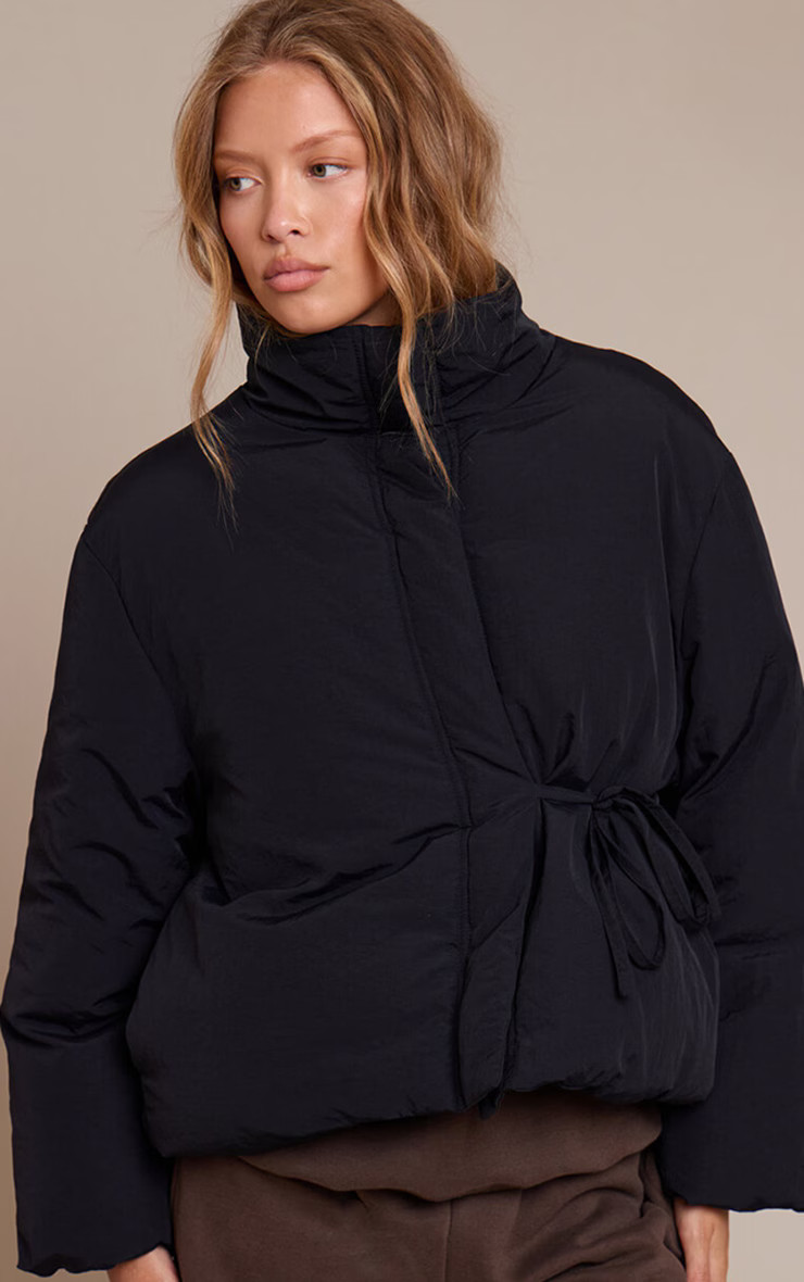 Black High Neck Tie Waist Quilted Puffer Jacket  | Outerwear | PrettyLittleThing US
