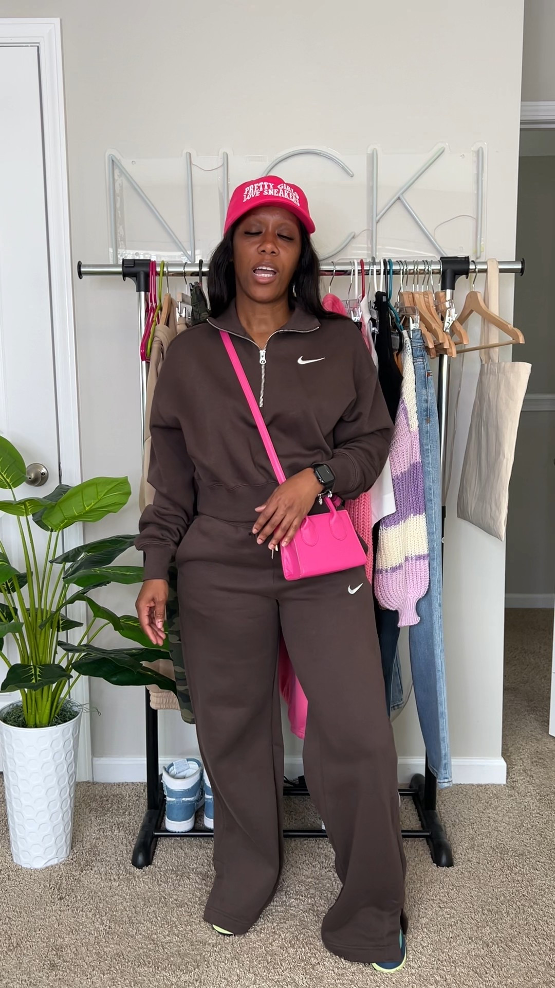 Outfit of the day. I’m wearing a brown quarter zip pullover from Nike. Brown split hem sweatpants from Nike. Pink dad hat from DSY Lifestyle. Pink mini crossbody bag from SHEIN. Jordan 1 Tokyo Biohack sneakers

#LTKSeasonal #LTKActive #LTKStyleTip