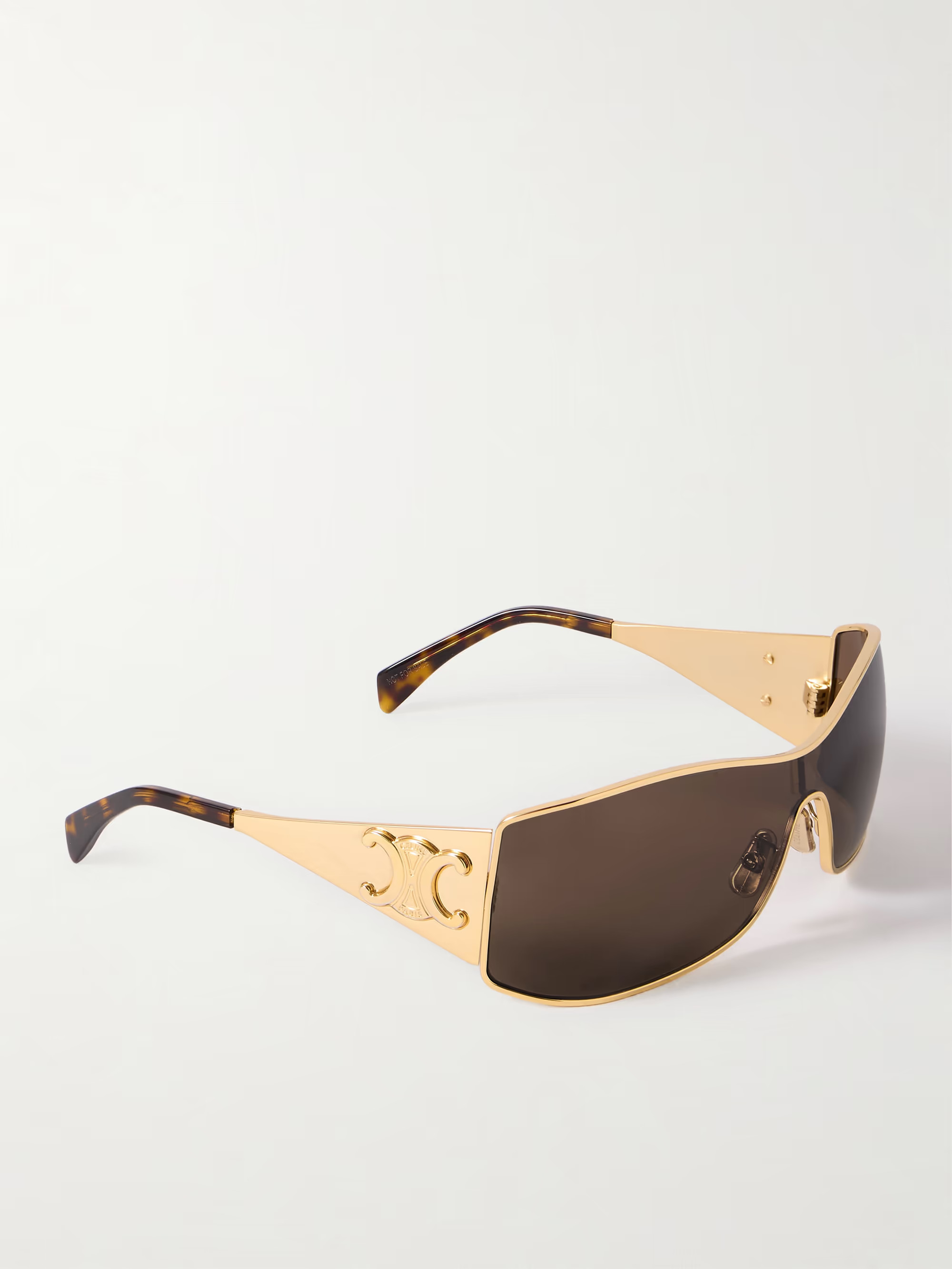CELINE Eyewear's sunglasses have rectangular frames and prominent arms inspired by Y2K racer styl... | NET-A-PORTER (US)