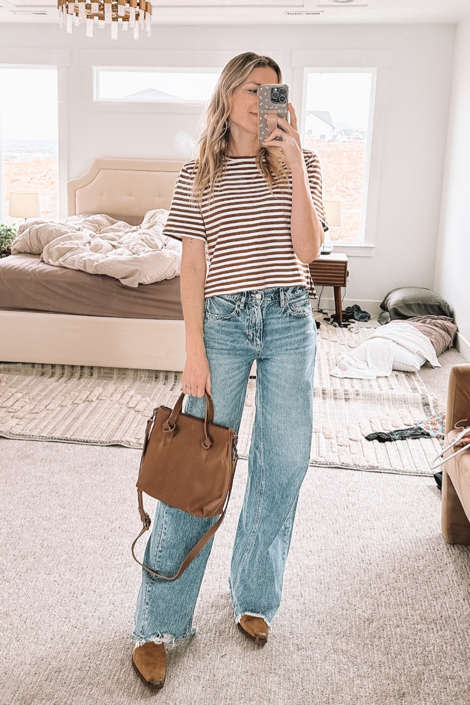 This tee is THE PERFECT FIT! Comes in solid colors and other striped colors too! This purse would make such a great Mother’s Day gift idea that she’d actually use constantly! And these jeans were $36 and perfection 👏🏼 wearing the long length and I’m 5’8"

#LTKfindsunder50 #LTKstyletip #LTKSeasonal