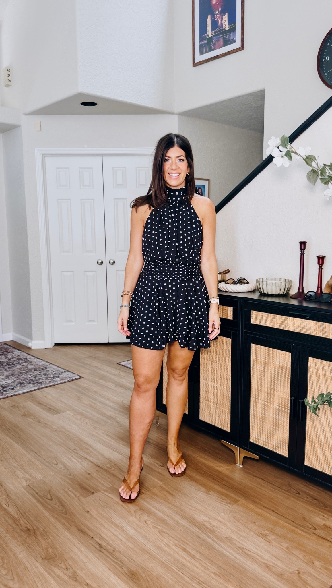 In a large polka dot halter dress

#LTKMidsize #LTKTall #LTKWedding