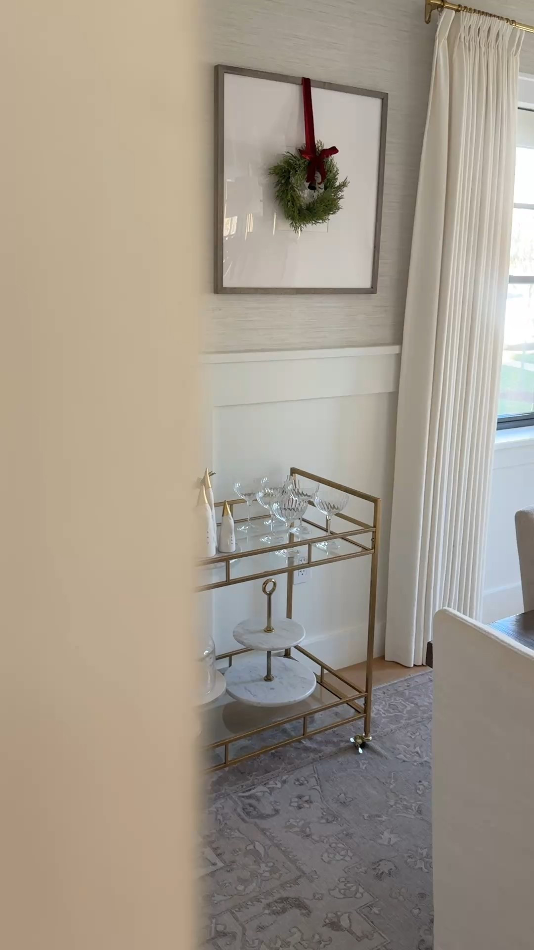 One of my favorite holiday details: mini wreaths on our gallery frames. They add a fresh pop of green and a festive touch without taking up any table space—perfect for holiday hosting. I also love using a bar cart nearby as extra storage and a display area for serveware, with space for drinks or a dessert station. The gallery frames are on sale right now, and I’ve linked them along with similar  options and bar cart favorites to recreate this look.

#LTKSeasonal #LTKHoliday #LTKHome