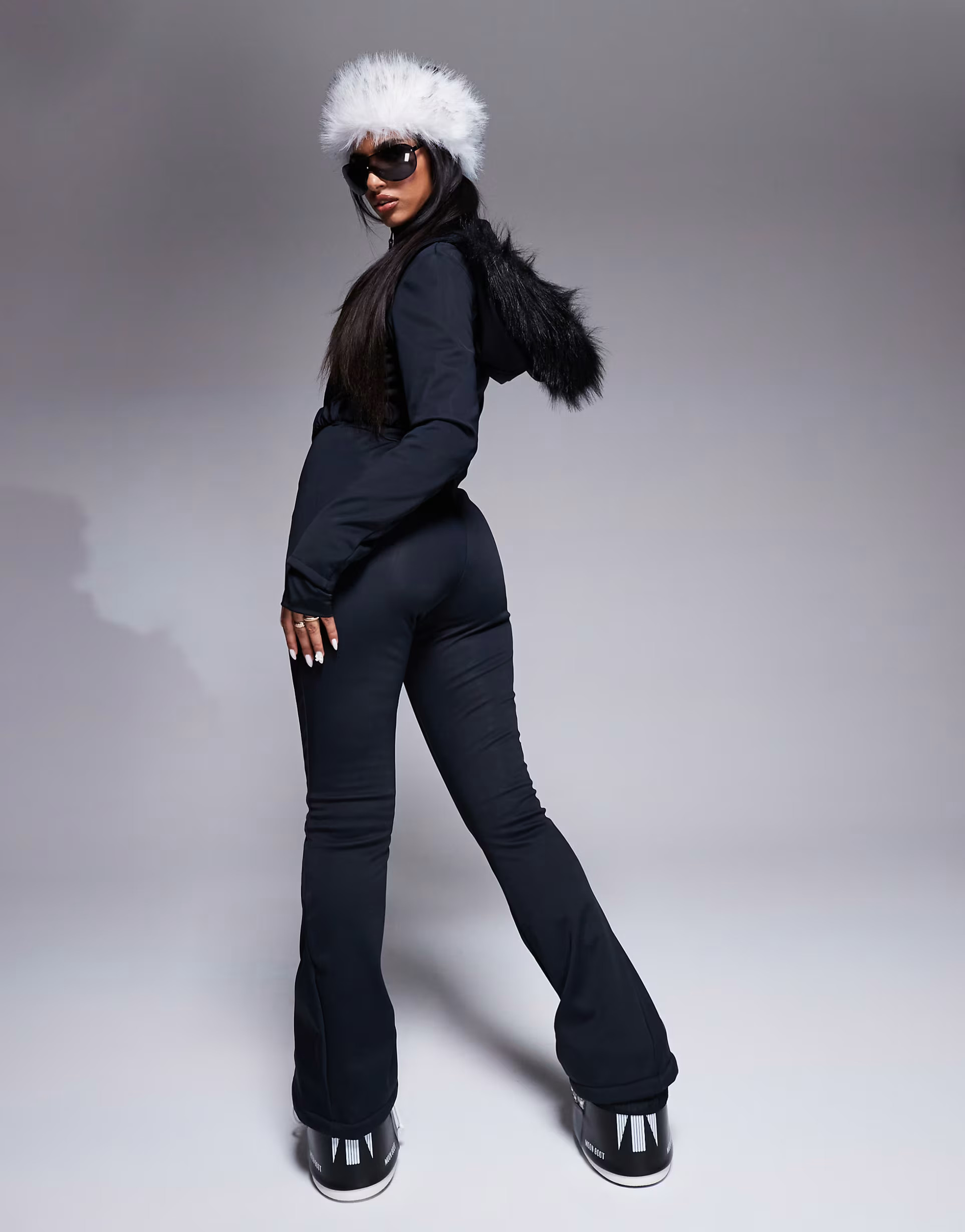 ASOS 4505 Ski belted ski suit with slim kick leg and faux fur hood in black | ASOS (Global)