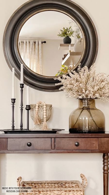 Neutral home decor ideas for the new year! Console table styling, amber glass vase, black candlestick holders, round mirror. 

#LTKhome #LTKsalealert #LTKstyletip