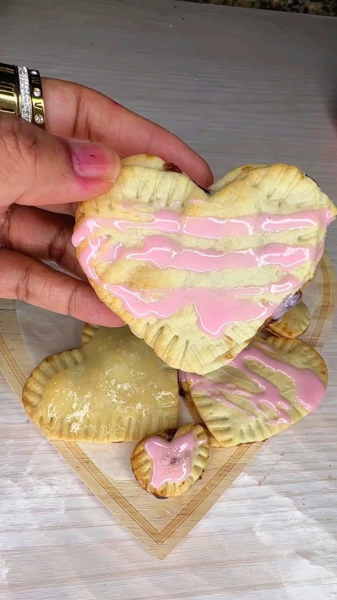 VALENTINE POP TARTS // Who doesn’t love a pop tart? I remember the first time my kiddos tried one and looked at me like I had been holding out on them. These heart shaped ones are super simple to make and taste so good!

You’ll need
- Refrigerated pie crust
- Strawberry jam or preserves
- Frosting
- Sprinkles
- Heart shaped cookie cutters
- Parchment paper
- Baking sheet

Let’s make them
- Preheat oven to 375 degrees
- Gently unfold pie crust, leaving it on the paper it comes wrapped in
- Cut out hearts using cookie cutters, making sure you have an even amount
- Top one heart with 1 tbsp of jam/preserves
- Top with plain heart
- Seal by pressing fork tubes along seams
- Line baking sheet with parchment paper
- Add each heart to baking sheet
- Bake for 10 minutes
- Microwave frosting for 30 seconds
- Stir and drizzle over hearts
- Add sprinkles if desired

These are so good! Let me know if you make them.



#LTKmomlife #LTKValentine #LTKSeasonal