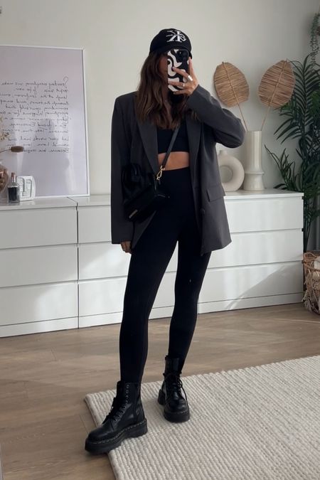 dressing up leggings and a sports bra for spring with a grey oversized blazer, chunky dr marten boots and Jacquemus cross body bag 