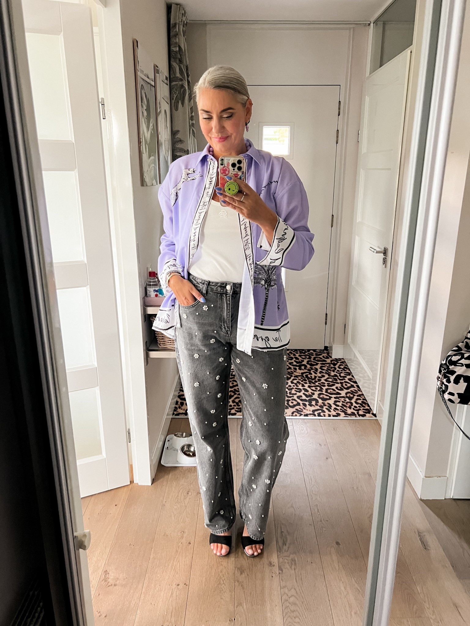Ootd - Thursday. Lilac print blouse (Shoeby, size M/L), white rib tank top (Shoeby), grey wide leg jeans with pearls (https://most-wanted-nl.mtpc.se/5529748) size XL/36”, lilac earrings, black velvet scrunchie and black suede heeled sandals. All shoes linked are available in extended sizes 



#LTKsummer #LTKeurope #LTKnederlands