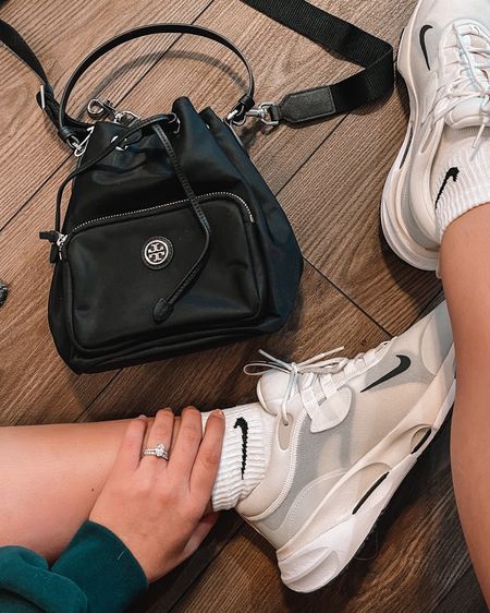 The perfect upscale bag for on the go. I love this sportier look and it’s perfect if you’re a mom because the nylon wipes right clean. Love these white Nike sneakers. They are a mix between a classic pair of Nike tennis shoes and the thicker sole dad tennis shoes that everyone is wearing. Both are great prices. The sneakers and bag come in more than 3 colors  

#LTKitbag #LTKfit #LTKshoecrush