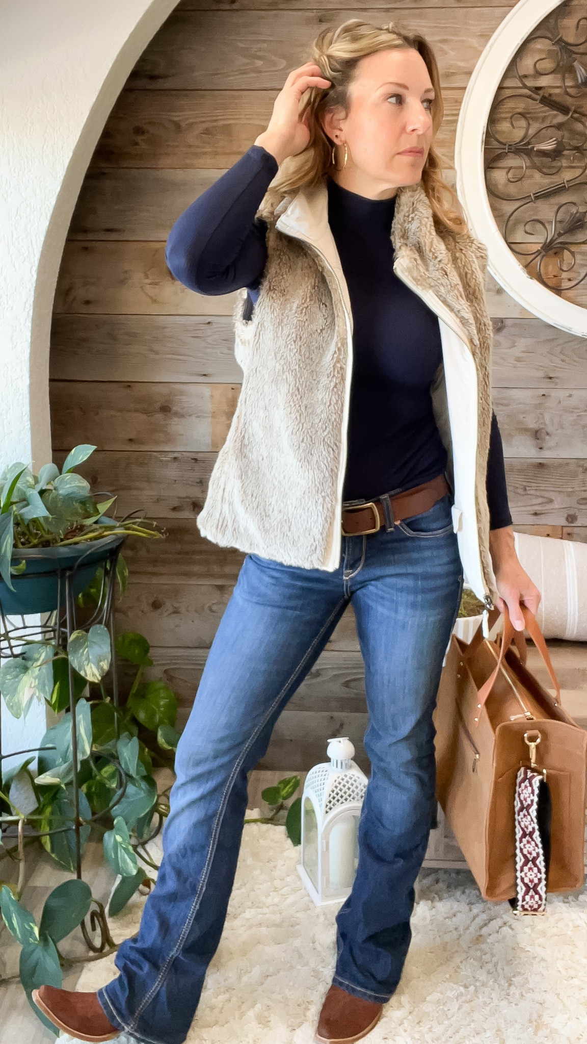 If I can’t wear my cowboy boots I’m not going @ariatinternational 
Jeans: Ariat
Boots: Lane.official
Vest: my own
Long sleeve: @walmart
Bag: @threadedpear 
Jewelry: Elli Parr (code LTKGloria for 20%)

#LTKsalealert #LTKSeasonal #LTKstyletip