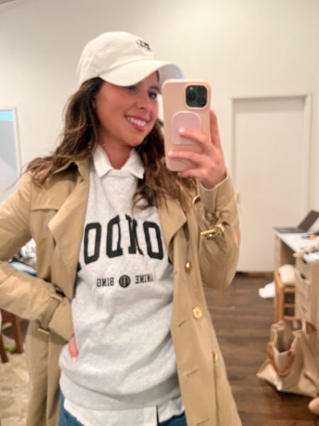 Button down layered under sweatshirt, trench coach, petite jeans, cute causal outfit, baseball hat outfit, BURBerry, anine bing, rails, Neiman Marcus, saks 