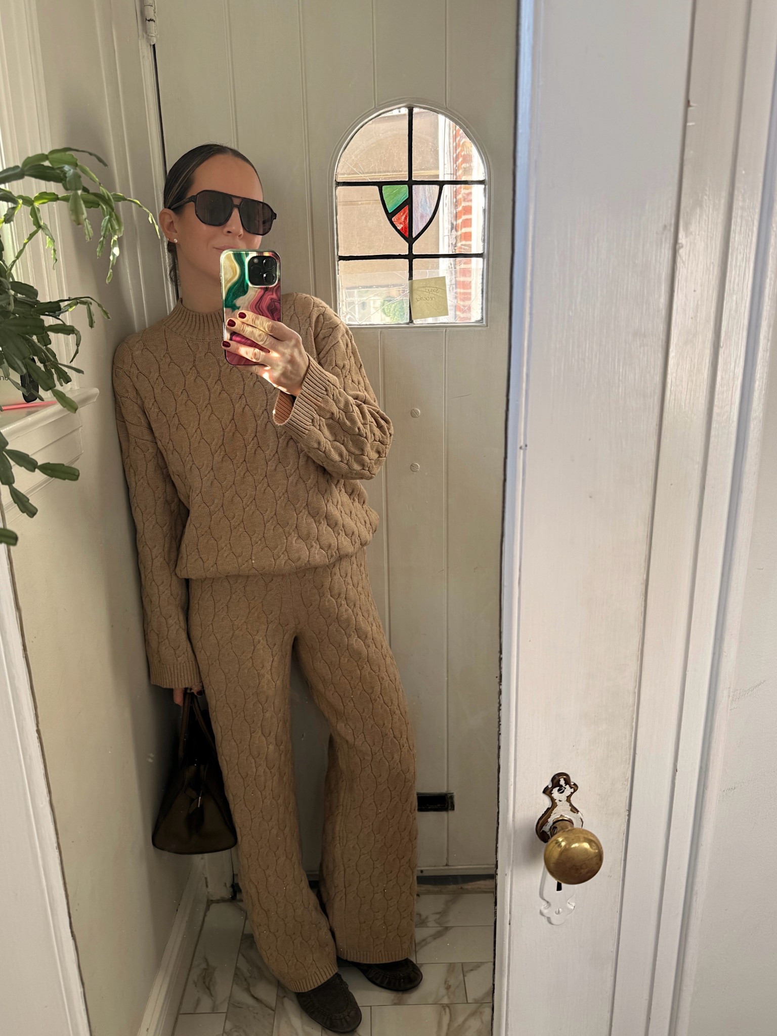 Wearing a medium in pants and sweater. 