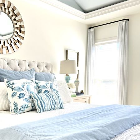 Create a beautiful layered look for your bed with these pretty blue and white bed linens!
