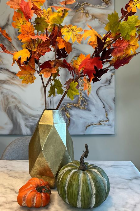 I used garland to create this maple leaf arrangement with tree branches. #fallhome #fallhomedecor #fallflorals 

#LTKSeasonal #LTKhome