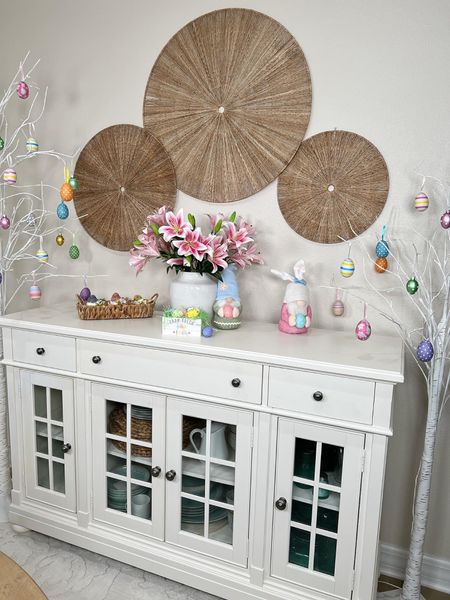 Beautiful White Buffet Cabinet with Pretty Spring Decor! Easter egg ornaments on the trees are my favorite! #home #amazon #amazonhome #founditonamazon #easter #easterdecor #spring #springdecor #diningroom #buffet #sideboard #coastaldecor #farmhousedecor #easterbunny 

#LTKhome