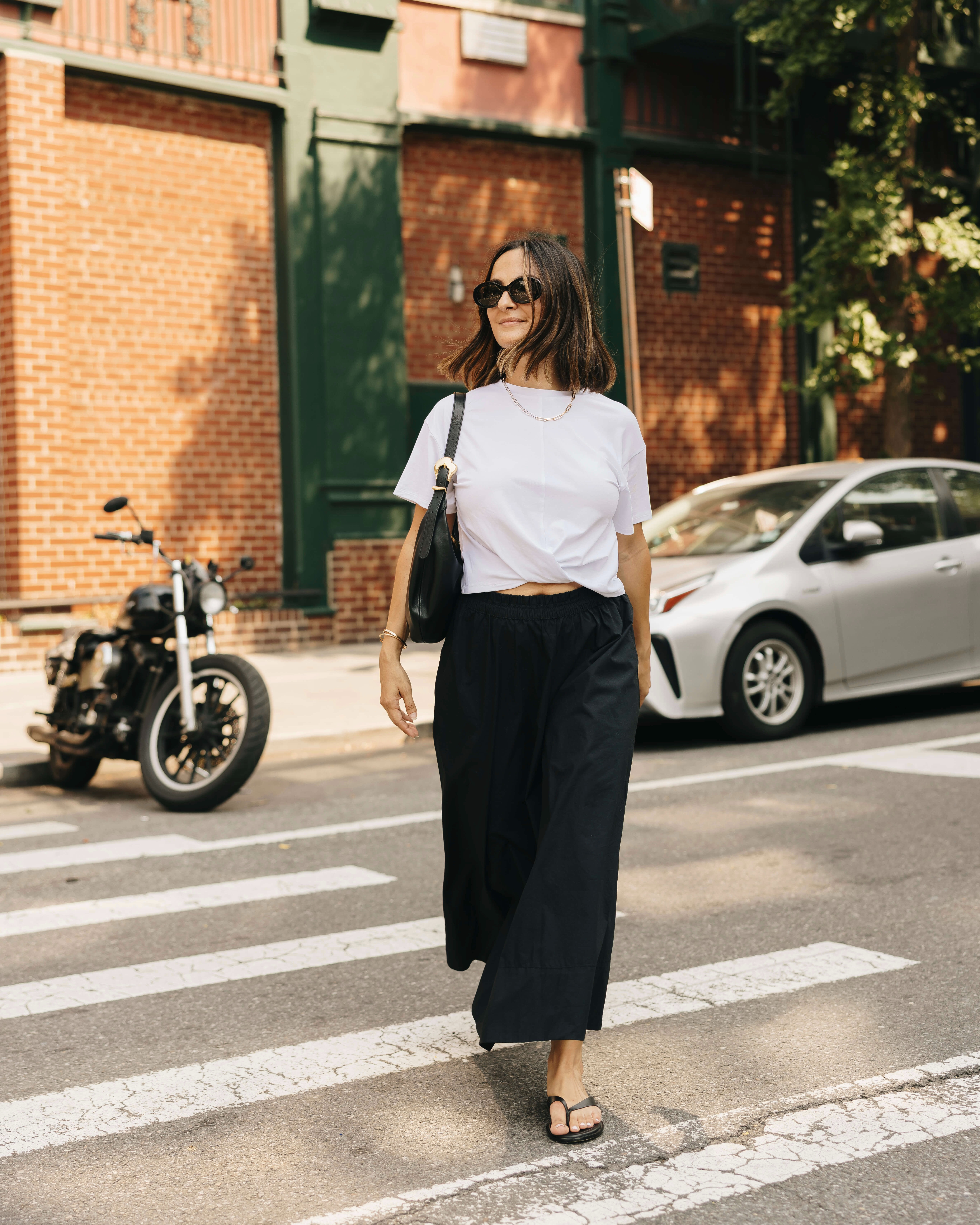 A classic poplin skirt outfit that never fails 🤍 Paired this easy white tee with a black poplin maxi skirt, simple flip flops, and a shoulder bag. Such an effortless combination for summer in the city, and one I’ll keep wearing into early fall!  

 #LTKdayinmylife #LTKootd #LTKSeasonal