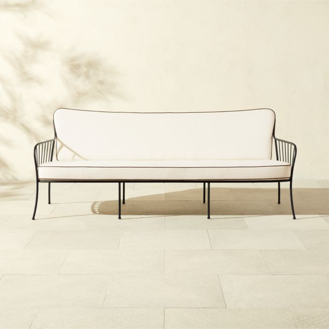 Welling Black Metal Outdoor Sofa with White Cushions | CB2