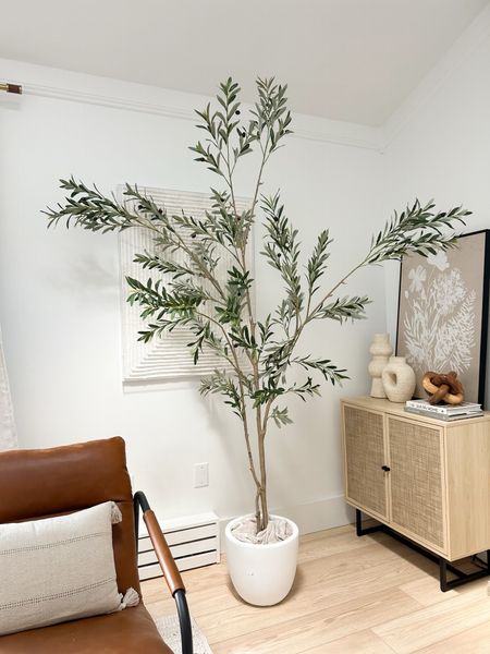Gorgeous 8 foot tree from Amazon paired with a creamy white planter  — a statement piece that provides spring color!

#LTKSeasonal #LTKhome #LTKstyletip