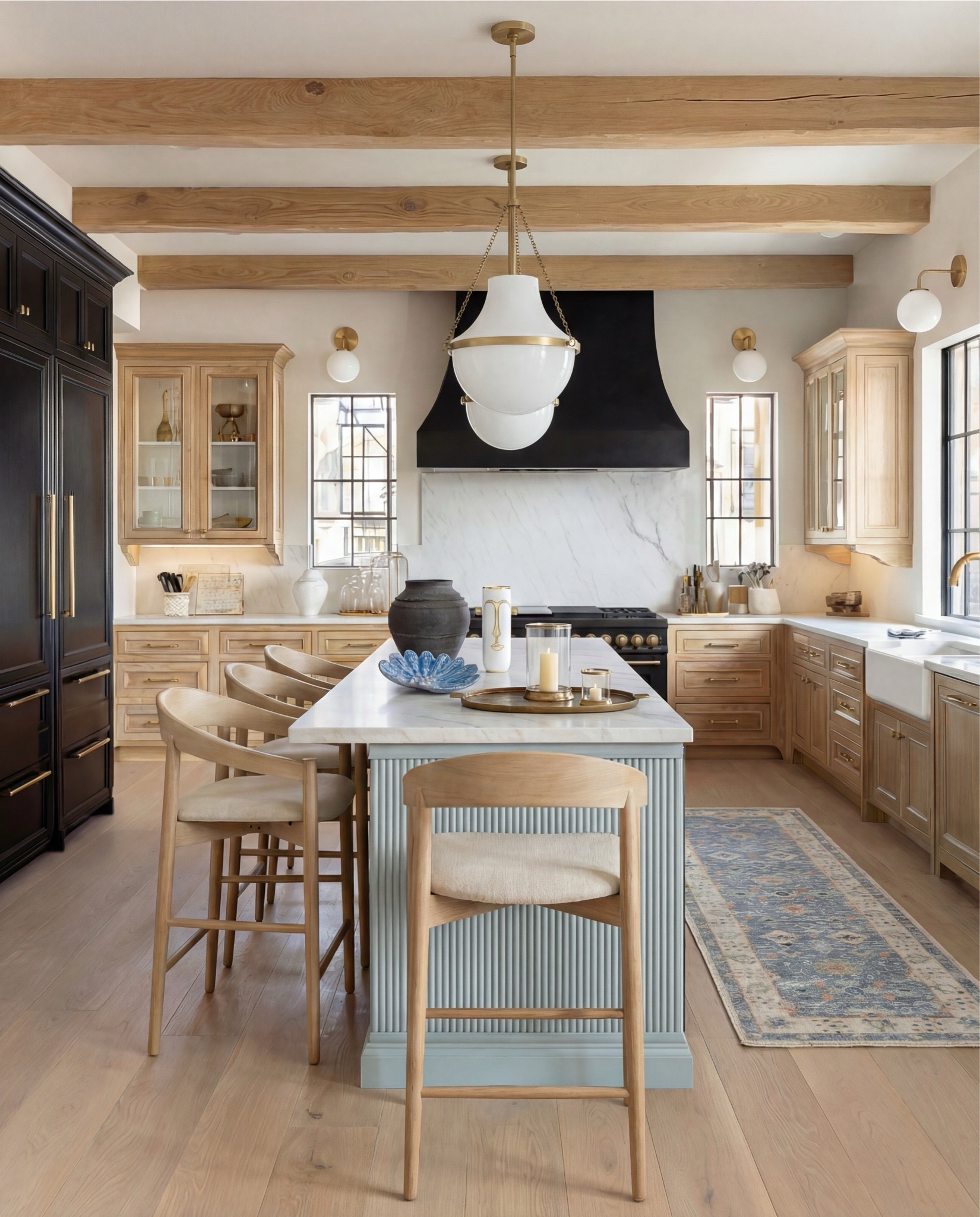 • Black range stove with brass knobs and handles
• Brass pendant light with white glass shade
• Brass wall sconces with globe shades
• Upholstered wood counter stools (light wood + neutral fabric)
• Vintage-style runner rug (soft blue and neutral tones)
• Black ceramic decorative vase
• White ceramic vase with brass detail

Shop the Look:
• Brass cabinet pulls and knobs
• Built-in wine fridge (dual-zone style)
• Under-counter beverage fridge
• Espresso / coffee machine
• Glass canister set for pantry storage
• Woven storage baskets (natural fiber)
• Decorative wood cutting boards
• Sculptural ceramic bowl (blue accent)
• Stoneware vase (matte black)
• Framed botanical artwork
• Vintage-style runner rug (blue + neutral tones)
• Small brass tray for bar accessories

• Blue sculptural ceramic bowl
• Brass tray with glass hurricane candle
•Brass serving tray decor
•Black terracotta vase jar
Brass gold drink shaker
Bar decor

#LTKSaleAlert #LTKHome