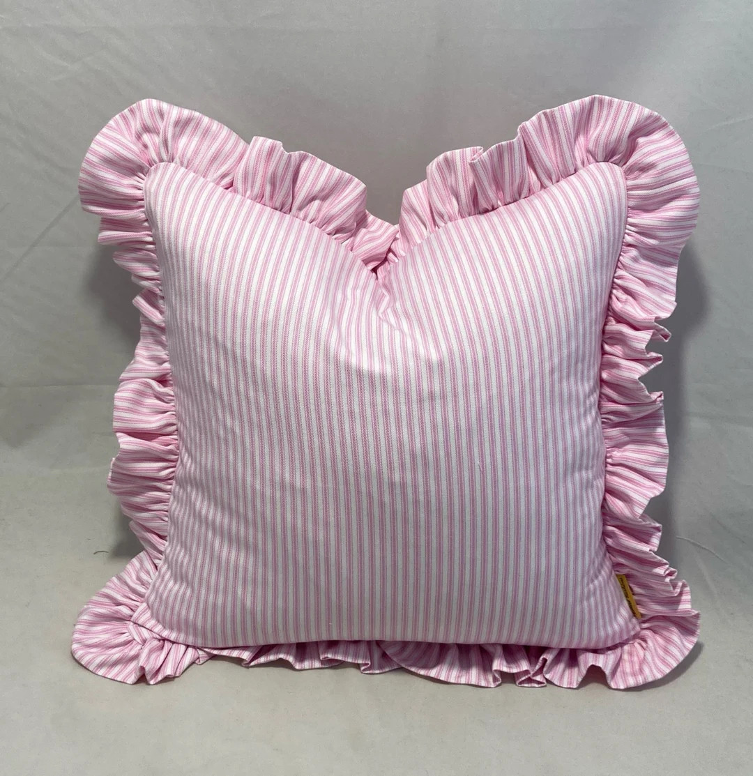 Dusty pink and white woven ticking fabric cushions with frill around them | Etsy (US)