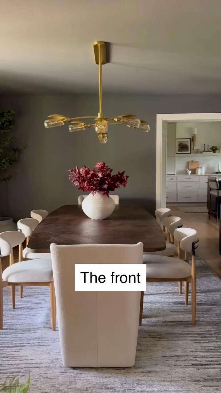 For #projectrusticcontemporaryranch, we wanted to create a dining room that felt warm and organic, but still refined enough to make everyday dinners—and the occasional holiday feast—feel a little more special.
 
A sculptural wood table anchors the room and comfortably seats eight, while two different chair styles keep the design collected rather than overly matched. Fully upholstered host chairs soften the ends of the table, and curved side chairs in high-performance fabric make the room practical for a busy family with three young girls.
 
The deep Amherst Gray walls bring the drama, balanced by natural wood, a softly textured rug, floor-to-ceiling drapery, and warm layers of light from the gold-and-glass chandelier and ceramic table lamps. A dark sideboard and expressive abstract artwork add contrast and a more contemporary edge.
 
This room is a reminder that rustic design does not have to feel heavy—and contemporary design does not have to feel cold. The best spaces often live somewhere in between.
 
Design // @peggyhaddadinteriors
Photography // @amandaproudfit
 
For sources and similar pieces from this space, comment SHOP and we’ll send the details your way. https://liketk.it/5fc6e

#PeggyHaddadInteriors #ProjectGrandmillennial #GrandmillennialKitchen #BlueAndWhiteKitchen TraditionalKitchen CollectedHome KitchenDesignInspo