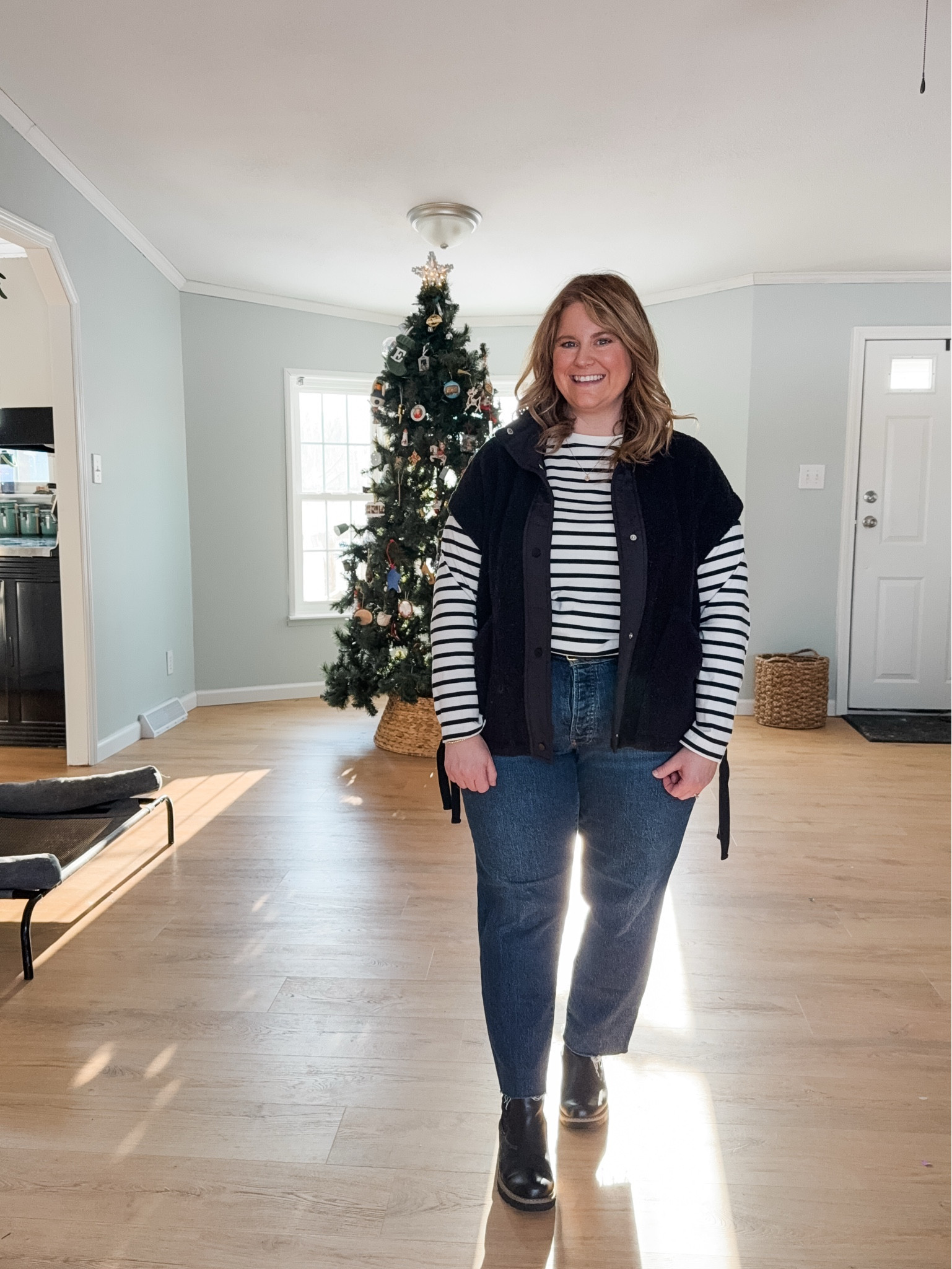 Wearing an XL in my fleece vest, large in my long sleeve tee (linked this years version) and a 14 petite in my jeans 

#LTKMidsize #LTKPetite #LTKSeasonal