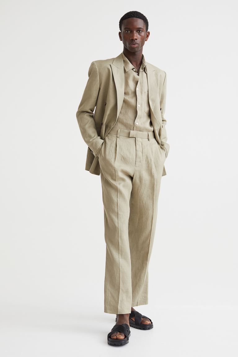 Relaxed-fit suit pants in linen with creases. Waistband with extended waistband tab and zip fly w... | H&M (US + CA)