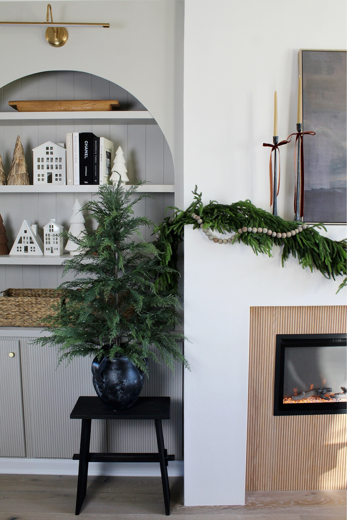 Fireplace, art, Christmas tree, ceramic houses, candle holders, ribbon, Norfolk Garland, ceramic trees 

#LTKSeasonal #LTKHome #LTKHoliday