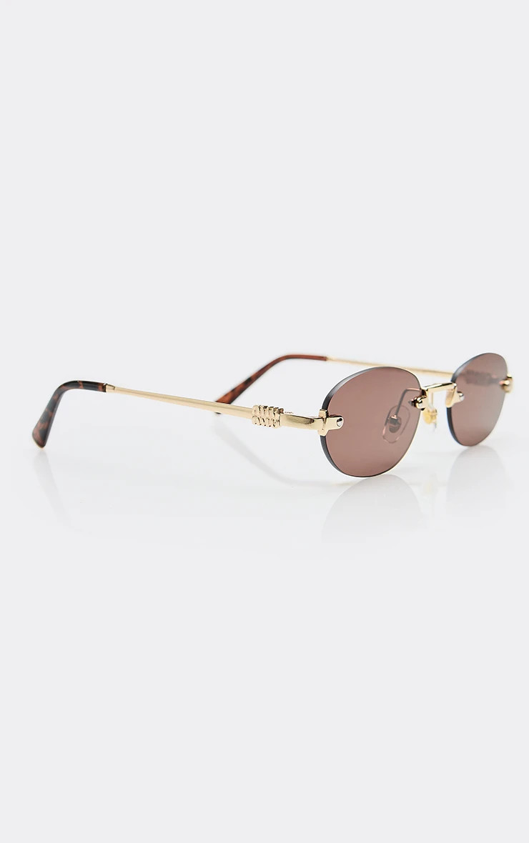 Side Logo Oval Shaped Tinted Lense Frameless Sunglasses In Brown And Gold | EGO (UK)