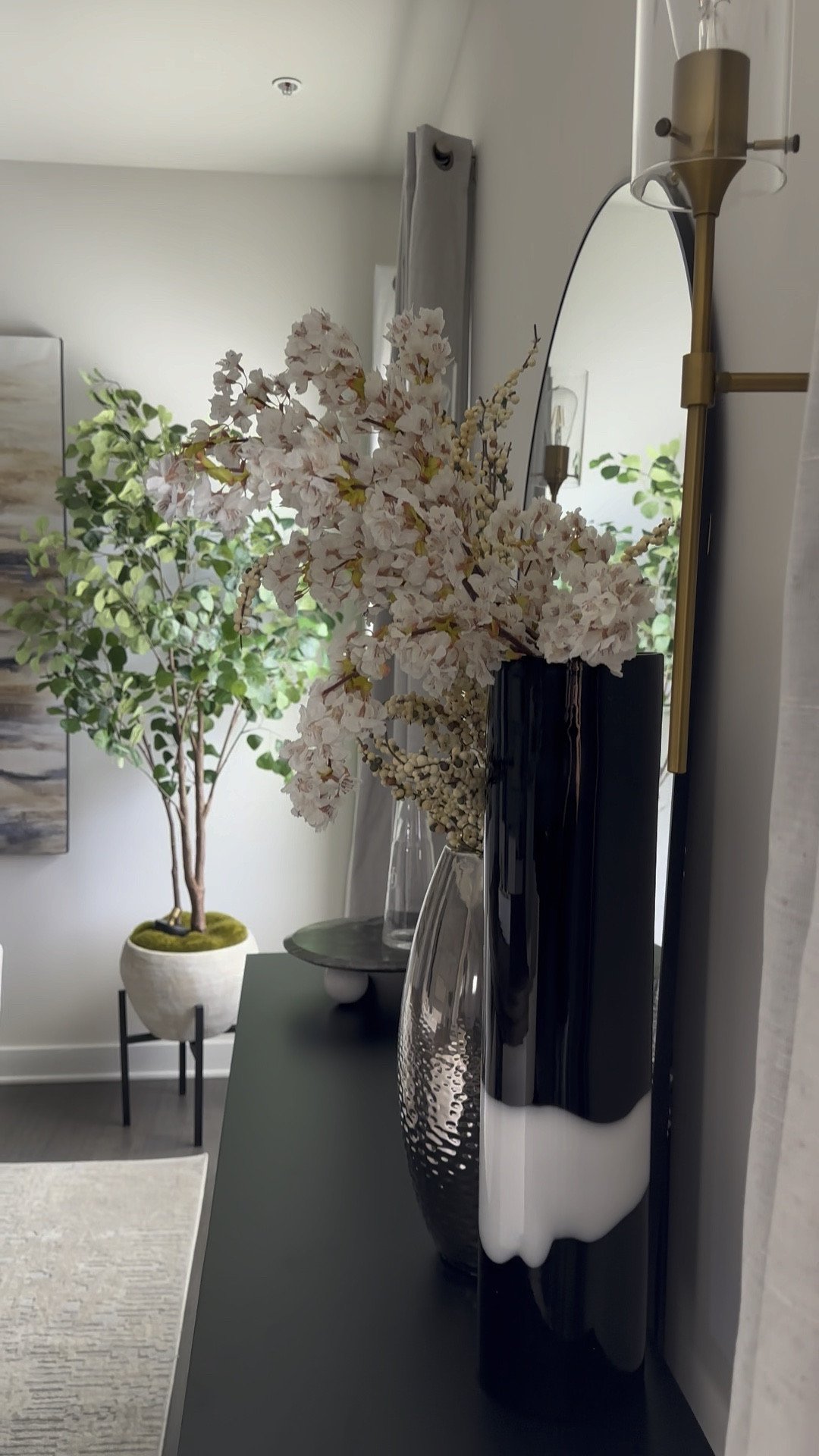 Have you looked at a space and thought something isn’t quite right? That’s what happened with our dining room. As I continued to hone my styling skills, I realized that the wall art wasn’t proportionate to the dining table and was overwhelming the space 🤦‍♀️. 

It’s important to have balance and a cohesive design. It’s also key to create a focal point in any room, so that direct where to draw attention and create a sense of order and flow. 

So I removed the 3rd piece of wall art (it’s hanging in our stairway), and centered the 2 pieces in front of the dining table, then added a nice faux tree (no green thumb here, sorry lol) to provide visual interest in the corner without overwhelming it. 

We changed the chandelier, dining chairs, and console table and added some fun wireless sconces! We also opted for a leaning floor mirror behind the console, and love it!

#LTKxTarget #LTKxAmazonHome 

#LTKHome #LTKStyleTip #LTKSaleAlert