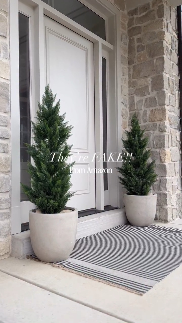 The MOST realistic I’ve seen!!✨ My most requested affordable 5-foot tall faux cedar outdoor trees, elevate my front porch YEAR-ROUND — and they’re from Amazon!🤌♥️ **I’ll also send my planter and rug links when you comment. 😘

I love that I can leave these cedar trees out year round for a “no muss no fuss” aesthetic look that requires absolutely no maintenance! 🙌  Just fluff, and forget. I’m positive you’ll love them too—especially when it comes time for holiday decorating! 🎄

As always, I’ve also put them in the link in my bio as a tappable image you can easily shop directly 😘 : https://amzlink.to/az0LUwGbdlXI4

✨Like this? Tap the FOLLOW button for more home design inspiration and shop my home and more great finds through the link in my bio.

Have a great day!!

Xoxo,
Andrea

#amazonhome #amazonmusthaves #amazonmusthave #amazoninfluencerprogram #frontporchdecor #frontporch #entrydecor #springporch #frontporchstep #amazonfavorites #amazonfavorite

Home decor
Curb appeal
Amazon home finds
Amazon best seller
Affordable home decor
Front porch cedar trees
Front porch decorating ideas
Year-round front porch trees
Faux trees for the front porch

#LTKFindsUnder100 #LTKHome #LTKStyleTip