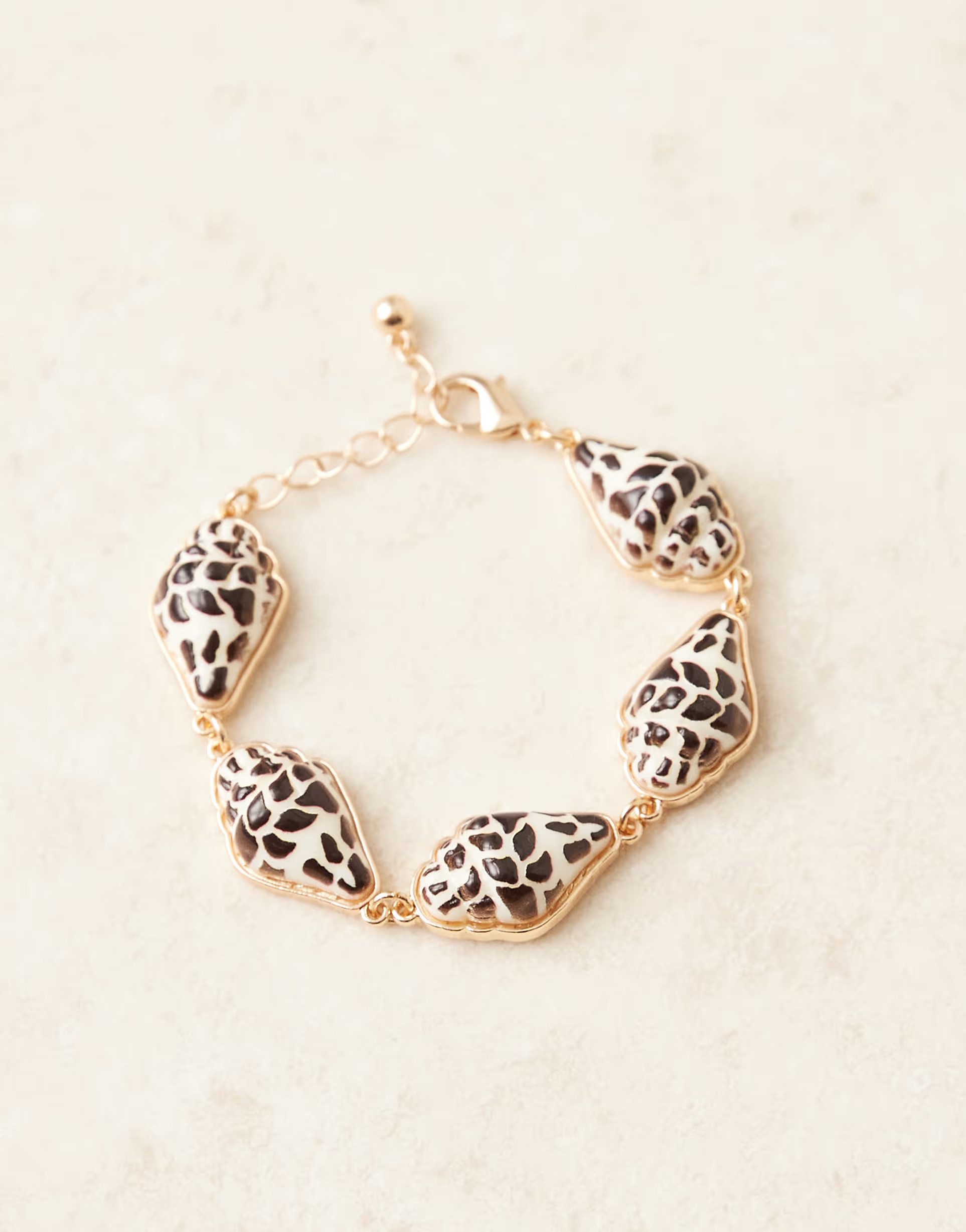 ASOS DESIGN bracelet with painted faux shell charms in gold tone | ASOS (Global)