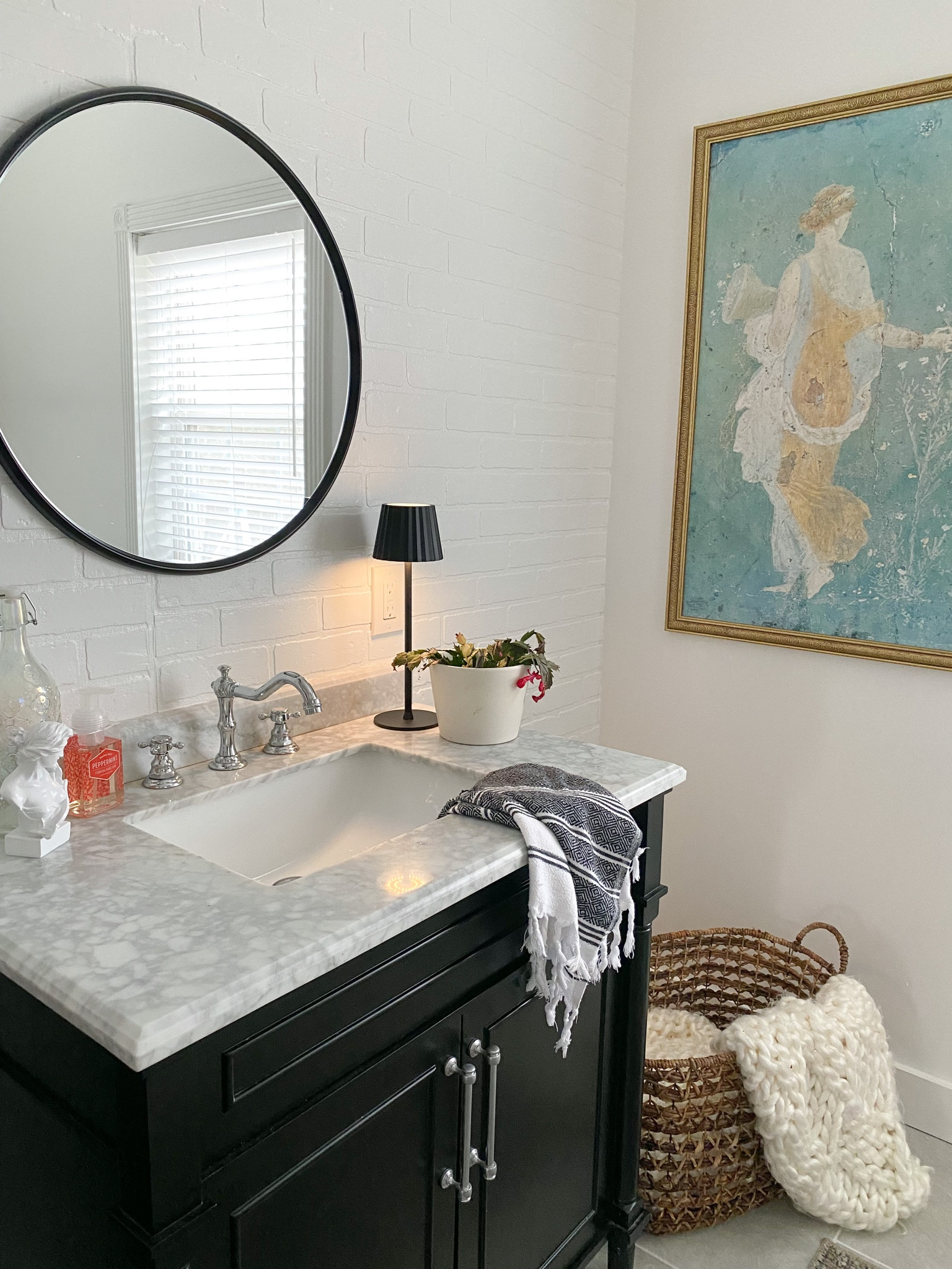 Cutest indoor outdoor metal led rechargeable lamp from Amazon.  
Matte black round mirror, Home Depot black bathroom vanity, amazon home French faucet 

#LTKhome #LTKunder100 #LTKunder50