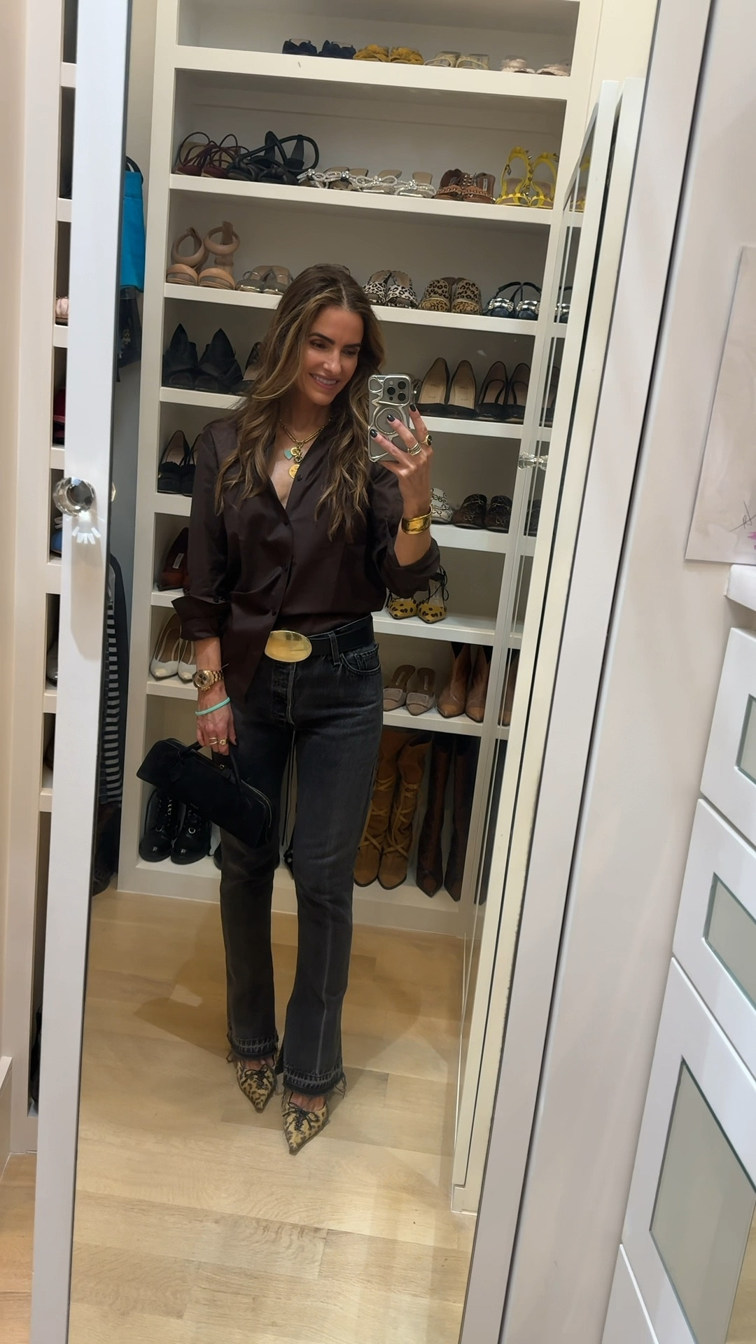 friday night date night #ootn nothing to wear? grab a beautiful, not boring button-down blouse (that you can dress up for the holidays too) w jeans & heels🤎

off to @writtenbytheseasons for first time! 

shop all my fav button- downs below here

+ you can never go wrong w a leg-lengthening, straight leg denim! 

& my go to chic belt, leopard print heels & black suede bag too! 

#LTKWatchNow 

#LTKShoeCrush 

#LTKWorkwear #LTKootd