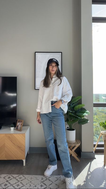 Casual chic outfit idea // yankee hat, white button up shirt, straight leg jeans, white sneakers // everyday style, casual style, French style, Parisian chic

#LTKstyletip #LTKfindsunder100 #LTKfindsunder50