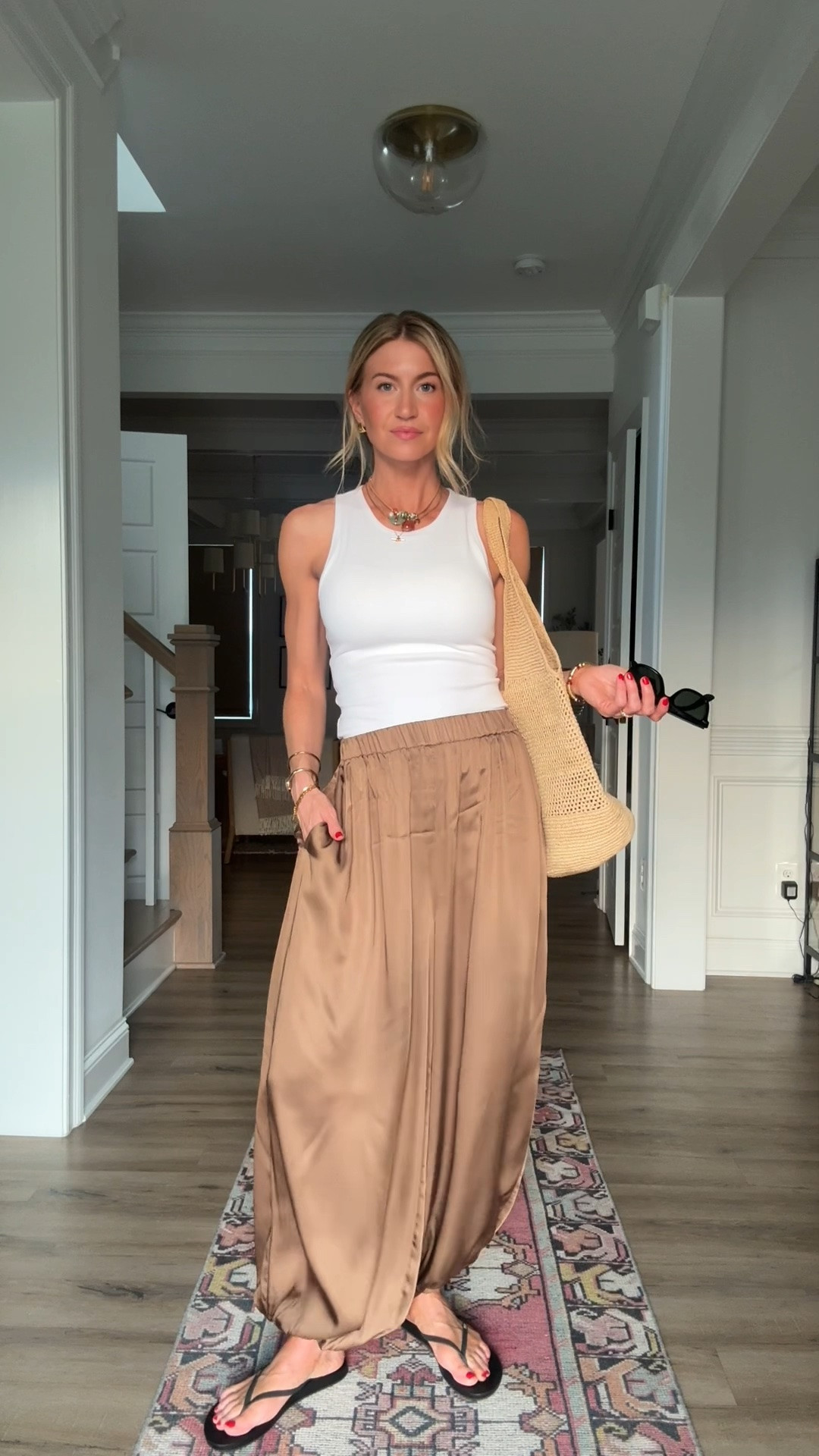 My white tank and bronze balloon pants were finally restocked! 

White tank: has a built in bra: TTS, wearing a S
Bronze silk balloon pants: TTS, wearing XS
Black sandals: runs slightly small, size up if in between sizes

#LTKootd #LTKgrwm #LTKdayinmylife