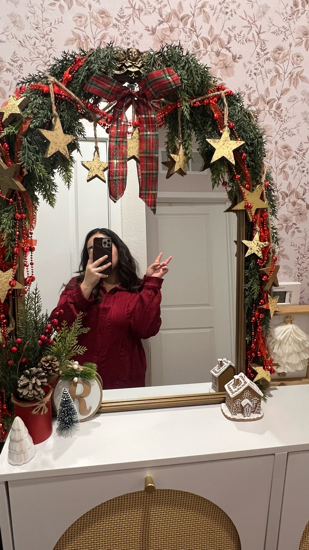 The Garland is the STAR of the show 😍🤭

I updated our entryway back in March so, this is my first year decorating with this wallpaper, bead board background and the shoe cabinet for Christmas🎄. And I gotta say, I’m sooo in love with how it turned out! Most of the decor itself is from previous years, but the newest update is the garland. It’s the perfect blend of green red and gold which are our colors for this year — a traditional Christmas of course 🥰❤️💚✨

At the time of this post all items are out of stock online BUT check out Hobby Lobby stores near you and let them know the SKU numbers 🫶🏼

Light up Cedar Garland (battery powered)- 6332431
Non light Cedar Garland option- 5560925
Red bead garland- 5058342
Star garland- 5986567
Red and Green Plaid Wired Edge Ribbon 1 1/2”- 5063243
.
.
.
#consoletable #consoletabledecor #christmas2025 #shoecabinet #shoecabinetdecor #christmastreedecorating #christmasdecorations #oldchristmas #nostalgicchristmas #vintagechristmas #consoletablestyling #christmasishere #christmasinspo #christmasmagic #traditionalchristmas 

Search 🔍: Christmas old style, vintage Christmas decor, festive Christmas decor, burgundy Christmas decor ideas, hot red Christmas decor, cedar garland, console table decor inspiration for Christmas #hobbylobby #hobbylobbychristmas

#LTKSeasonal #LTKHoliday