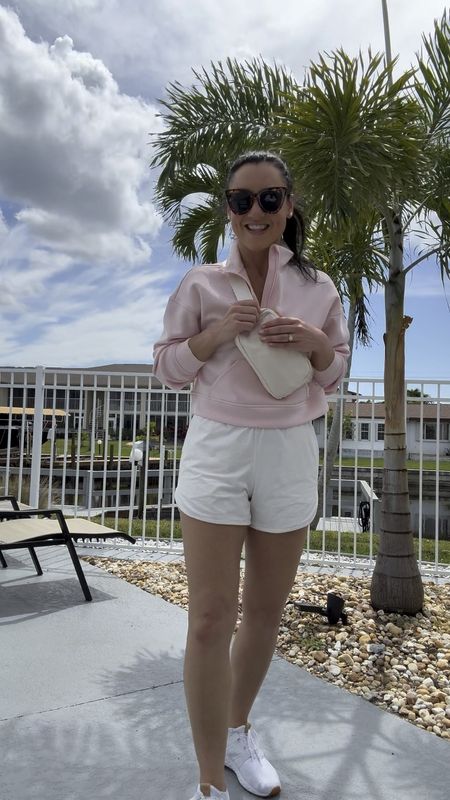 Casual vacation ootd☀️ This Target pullover is incredibly soft. Like, SO soft! And it’s a cool-to-touch fabric, so it kept me cool, even in the Florida heat! Paired with Target active shorts, my favorite $9 belt bag, and my go to white sneakers. 

Pullover also comes in 3 other colors!

Sizing:
Pink pullover fits TTS. It is a cropped fit. I’m wearing an XS.
Shorts fit TTS, wearing a S.
Shoes fit TTS.

Casual ootd, casual style, affordable style, mom outfit, target style, Target fashion, Amazon find 

#LTKfindsunder50 #LTKsalealert #LTKSeasonal