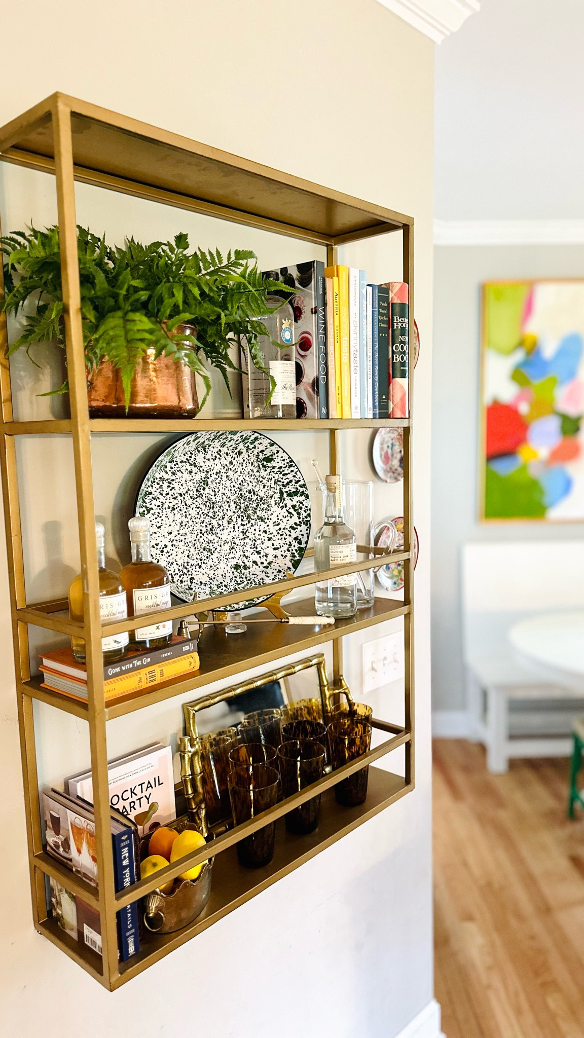 Bar shelf 
Splatter ware platter 
Faux fern 
Brass planter 
Tortoise glassware 
Ballard Designs shelf 


#LTKhome