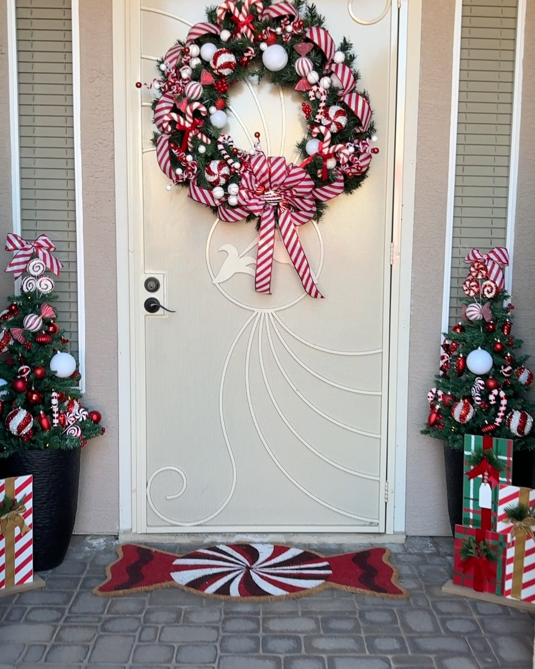Turned our porch into peppermint perfection 🍬🎄
Cute, fun, and budget-friendly because festive doesn’t have to be expensive. 😉

Rug is from At Home Stores
Wreath is from a yard sale but I added all decor from Hobby Lobby & Michael’s 
Christmas trees from Amazon 🥰
Wood Gifts Decor from Hobby Lobby 80% last year 😃

#LTKFindsUnder100 #LTKSeasonal #LTKHoliday