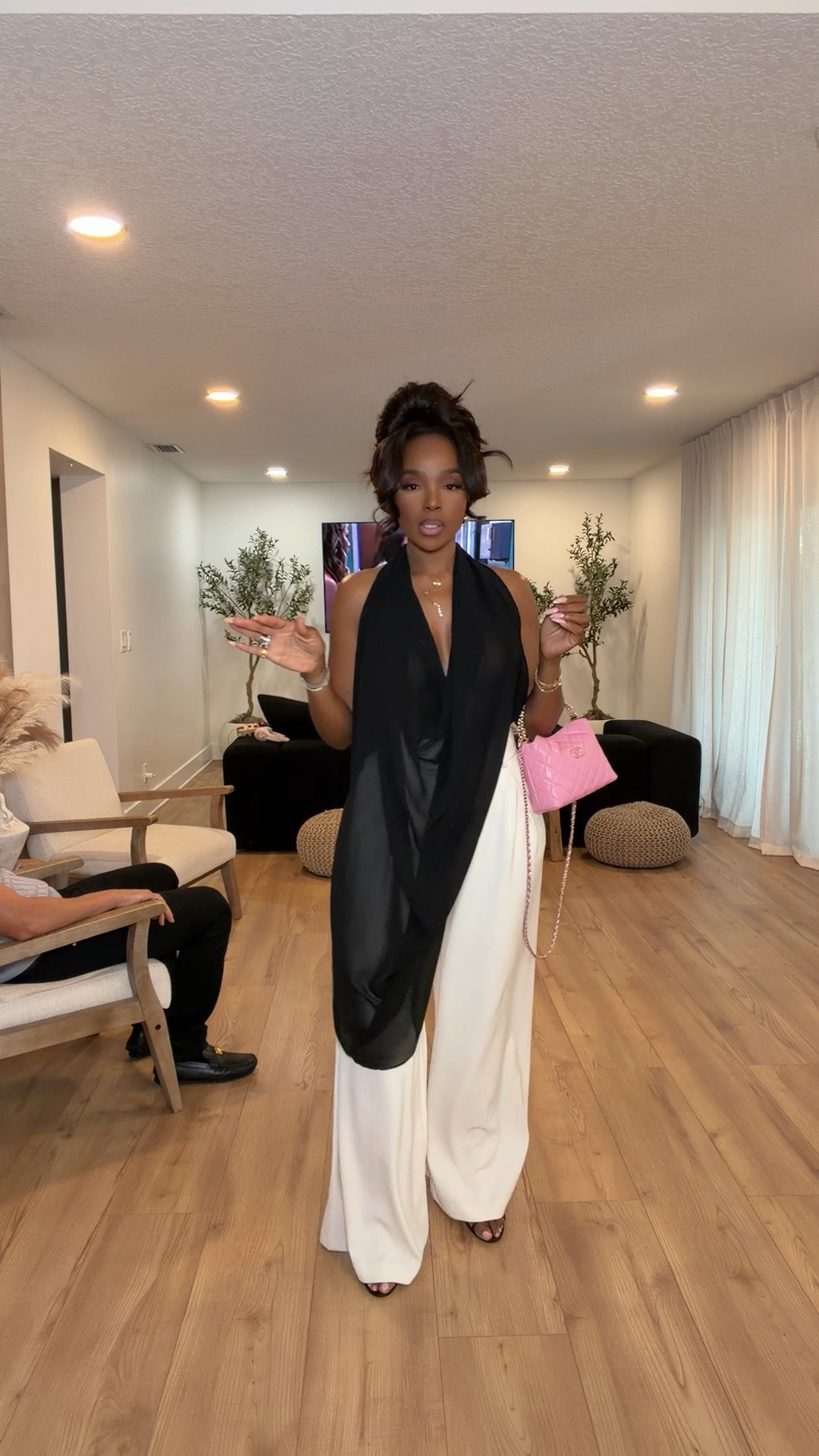 Scroll to shop this elevated black and white moment 🖤✨

This draped halter top paired with flowy white trousers is such a statement look without even trying too hard. The contrast styling feels rich, sophisticated, and effortlessly luxe, especially with the pop of pink from the mini bag. Definitely one of those outfits that instantly gives expensive energy and photographs beautifully.

Perfect for upscale dinners, vacation nights, rooftop cocktails, birthday celebrations, girls night out, and summer events.

5’4 | 140LBS | 34D-27-40 | size small or 4

Black and white outfit, elegant summer style, elevated evening outfit, chic vacation look, flowy wide leg trousers, classy dinner outfit, luxury inspired fashion, monochrome outfit aesthetic, sophisticated resort wear, dressy summer outfit, statement halter top, quiet luxury style

Follow me on Instagram and YouTube @kirasfashionfinds